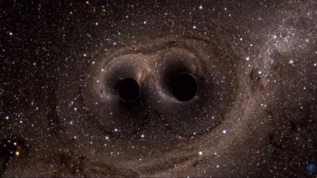 Deux trois noirs qui entrent en collision, générant des ondes gravitationnelles. - © LIGO